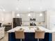 Open concept kitchen with pendant lighting, center island with barstool seating, and stainless steel appliances at 340 Louise Ln, Canton, GA 30114