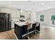 Modern kitchen with center island, pendant lighting, stainless steel appliances, and barstool seating at 340 Louise Ln, Canton, GA 30114