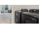 Modern laundry room with black washer and dryer set at 340 Louise Ln, Canton, GA 30114