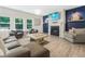 Spacious living room with a cozy fireplace, comfortable seating, and plenty of natural light at 340 Louise Ln, Canton, GA 30114