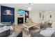Modern living room with fireplace, TV, ample seating, and beautiful flooring at 340 Louise Ln, Canton, GA 30114