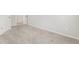 Empty room with two open doorways and a neutral-colored carpet at 340 Louise Ln, Canton, GA 30114