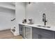 Modern bar area with stainless steel beverage cooler and sleek fixtures, perfect for entertaining guests at 4250 Summit Dr, Marietta, GA 30068