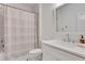 Well-lit bathroom featuring a shower-tub combo and a single sink vanity at 4250 Summit Dr, Marietta, GA 30068