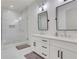 Modern bathroom featuring double vanities, a glass-enclosed shower, and sleek fixtures at 4250 Summit Dr, Marietta, GA 30068