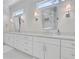 Bathroom vanity with double sinks, white cabinetry, and a sleek countertop at 4250 Summit Dr, Marietta, GA 30068
