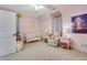 Charming bedroom with crib, soft colors, and a cozy reading nook at 4250 Summit Dr, Marietta, GA 30068