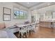 A charming dining area features a built-in bench and open access to a bright, modern kitchen at 4250 Summit Dr, Marietta, GA 30068