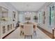 Bright and stylish dining room featuring elegant wainscoting, a large dining table, and a sparkling chandelier at 4250 Summit Dr, Marietta, GA 30068