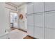 Hallway with hardwood floors, gray cabinets, and stylish decor at 4250 Summit Dr, Marietta, GA 30068