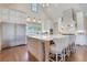 Spacious kitchen with white cabinets, a large center island, stainless steel appliances, and modern lighting fixtures at 4250 Summit Dr, Marietta, GA 30068