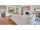 Open-concept living room with fireplace, hardwood floors, and connection to a dining area at 4250 Summit Dr, Marietta, GA 30068
