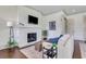 Bright living room featuring a brick fireplace and comfortable seating arrangement at 4250 Summit Dr, Marietta, GA 30068