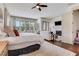 A generous primary bedroom featuring a fireplace and sitting area with abundant natural light at 4250 Summit Dr, Marietta, GA 30068