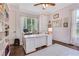 Bright home office with custom built-ins, a large window, and hardwood floors at 4250 Summit Dr, Marietta, GA 30068