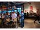 A busy bar scene with patrons seated at tables and standing around the bar at 1174 Princess Sw Ave, Atlanta, GA 30310