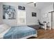Cozy bedroom featuring a large lion art piece, a ceiling fan, a window, and ample space at 1174 Princess Sw Ave, Atlanta, GA 30310