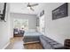 Bedroom with a full-sized bed, ceiling fan and wood flooring at 1174 Princess Sw Ave, Atlanta, GA 30310