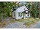 Quaint two-story house with a covered front porch and a neat, grassy yard at 1174 Princess Sw Ave, Atlanta, GA 30310