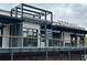Exterior view of a modern food hall with metal framework and ample outdoor seating at 1174 Princess Sw Ave, Atlanta, GA 30310