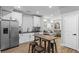 Bright, renovated kitchen with stainless steel appliances and a view of the living room at 1174 Princess Sw Ave, Atlanta, GA 30310
