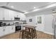 Bright, renovated kitchen with stainless steel appliances and a breakfast table at 1174 Princess Sw Ave, Atlanta, GA 30310