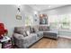 Comfortable living room featuring a plush gray sectional sofa with decorative pillows at 1174 Princess Sw Ave, Atlanta, GA 30310