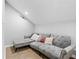 Living room featuring light gray walls, wood look floors, and a large gray couch with an ottoman at 1174 Princess Sw Ave, Atlanta, GA 30310