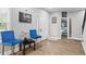 Cozy sitting area with two blue chairs and decorative art at 1174 Princess Sw Ave, Atlanta, GA 30310