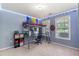 A bedroom with a bunk bed over a desk, neutral carpet, and motorcycle decor at 3589 Garden Manor Dr, Loganville, GA 30052