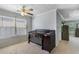 Bedroom with neutral walls, carpeted floors, a ceiling fan and closet with plenty of natural light at 3589 Garden Manor Dr, Loganville, GA 30052