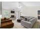Inviting living room with fireplace, vaulted ceilings, and stylish furnishings at 3589 Garden Manor Dr, Loganville, GA 30052