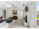 Cozy living room with vaulted ceiling, fireplace, and plenty of natural light at 3589 Garden Manor Dr, Loganville, GA 30052