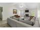Spacious living room with fireplace, ceiling fan and comfortable seating at 3589 Garden Manor Dr, Loganville, GA 30052
