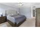 Spacious main bedroom with trey ceiling, neutral walls, and carpeted floor at 3589 Garden Manor Dr, Loganville, GA 30052
