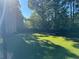 Expansive backyard with well-maintained lawn and privacy fence, perfect for outdoor enjoyment at 704 Kenton Ct, Locust Grove, GA 30248