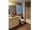 Bright bathroom with double sink vanity, shower, and tiled floors at 704 Kenton Ct, Locust Grove, GA 30248