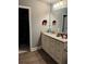 Bathroom vanity with granite countertops and tiled floors at 704 Kenton Ct, Locust Grove, GA 30248