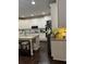 Bright, spacious kitchen with white cabinets, granite counters, and stainless steel appliances at 704 Kenton Ct, Locust Grove, GA 30248