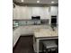Stylish kitchen with a spacious island, updated appliances, and ample cabinet space at 704 Kenton Ct, Locust Grove, GA 30248