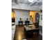 Spacious living room with hardwood floors, elegant decor, and a view of the entryway and dining area at 704 Kenton Ct, Locust Grove, GA 30248