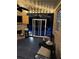 Enclosed porch and patio with fireplace, ceiling fan, and view of the pool at 704 Kenton Ct, Locust Grove, GA 30248