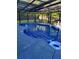 Enjoy the fabulous screened-in pool and outdoor area with plenty of space for entertaining and relaxing at 704 Kenton Ct, Locust Grove, GA 30248