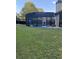 Backyard view of an enclosed in-ground pool at 704 Kenton Ct, Locust Grove, GA 30248