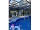 Beautiful enclosed pool area with comfortable seating, backyard views, and serene setting at 704 Kenton Ct, Locust Grove, GA 30248