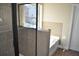 Bathroom showcasing tiled shower, tub, and door to the toilet at 920 Crescent Ridge Dr, Buford, GA 30518