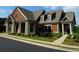Craftsman style home exterior with covered porch, columns, and well maintained lawn at 920 Crescent Ridge Dr, Buford, GA 30518