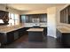 Stylish kitchen with dark wood cabinets, stainless steel appliances, and granite countertops at 920 Crescent Ridge Dr, Buford, GA 30518