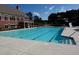 Beautiful community pool with slide, lane markers, and ample space for relaxation and recreation at 920 Crescent Ridge Dr, Buford, GA 30518