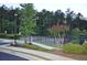 Well-maintained community tennis courts surrounded by lush landscaping for active recreation at 920 Crescent Ridge Dr, Buford, GA 30518